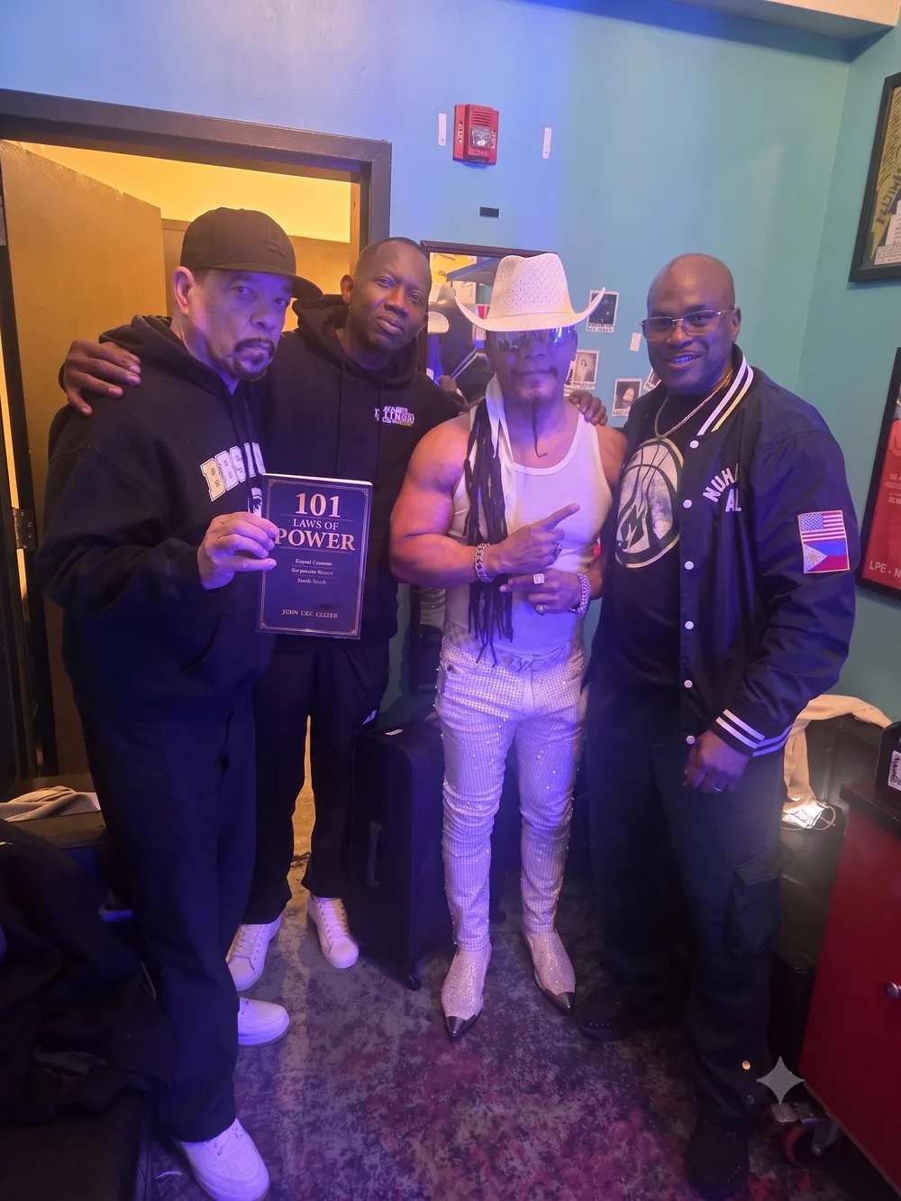 Ice-T holding Doc Fuller's 101 Laws of Power backstage, with Melle Mel
